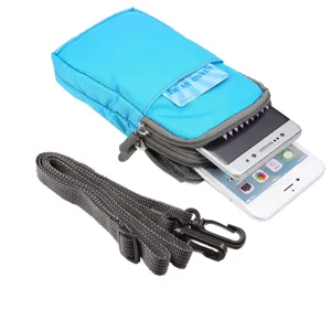 Detail view of blue canvas multi-pocket cell phone pouch with adjustable strap and card slot.