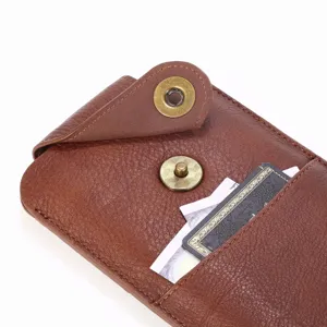 Close-up detail of genuine leather phone pouch with magnetic closure and card slot.