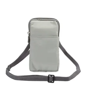 Grey canvas mini phone crossbody bag detail, showing adjustable strap and zippered pocket.