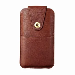 Detailed view of brown leather phone pouch, vertical holster with metal snap button.