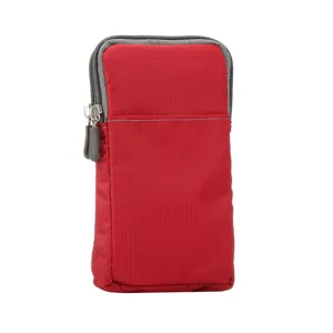 Detail view of the red canvas phone waist bag, featuring durable zippers and practical pouch.