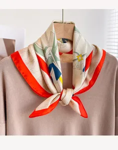 Detailed view of a chic women square silk scarf with striking orange border and geometric print.