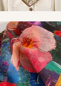 Close-up detail of artistic floral printed silk scarf fabric showing oil painting design.