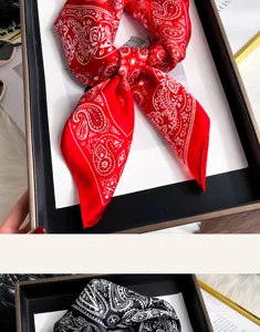 Red and black paisley silk square scarf, vintage bandana style detail view showing rich fabric.
