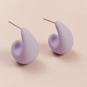 Detailed view of minimalist matte purple teardrop stud earrings, simple elegant everyday jewelry.
