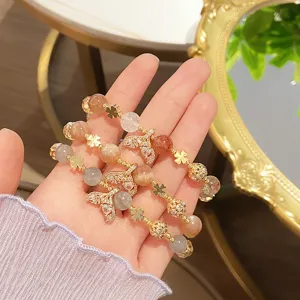 Elegant crystal bracelet with orange moonstone and cute mermaid tail charms for daily wear.