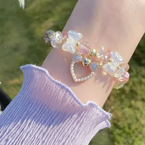 Sweet crystal glazed butterfly bead bracelet detail view, elegant girly style wrist jewelry.