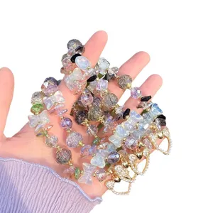 Sweet cracked crystal glass bead bracelet with bow and heart charms for women and girls.
