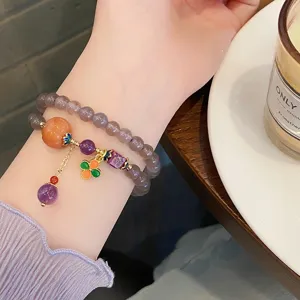 Elegant grey chalcedony beaded bracelet with vintage gourd and lotus pendant for women.