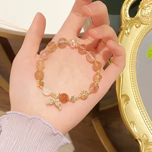 Stunning crystal beaded bracelet with a sparkling mermaid tail pendant and sweet clover charms.