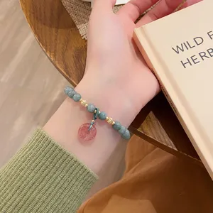 Bracelet de perles en jade vert avec pendentif boucle de paix rose, bijoux ethniques.