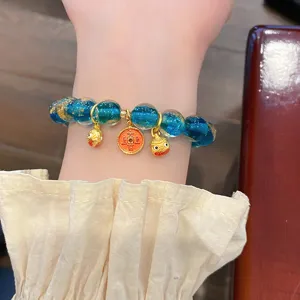 Bracciale di perle in vetro blu con foglia d'oro e ciondoli, stile vintage cinese.