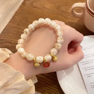 Bracciale di perle di vetro con foglia d'oro in stile cinese vintage con ciondoli animali.