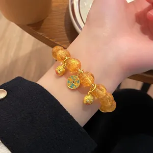Bracciale in perle di vetro foglia d'oro stile cinese vintage con ciondoli dettagli