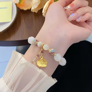 Bracelet de perles de feuille de lotus style chinois, design doux avec pierres colorees.