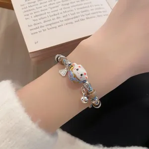 Exquisite ceramic lucky cat beaded bracelet with cute metal charms for women daily wear.