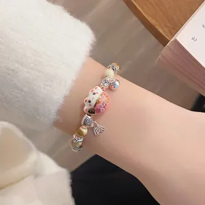 Ceramic lucky cat bracelet featuring exquisite silver beads and cute design, ideal for daily wear.