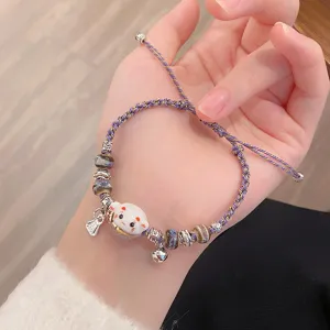 Charming ceramic lucky cat braided bracelet with bell, cute friendship wrist jewelry for women.