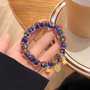 Bracciale in perle di vetro con foglia d'oro blu stile cinese retro con graziosi mini ciondoli.