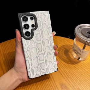 Detailed view of white snakeskin texture phone case with black camera protection for Samsung.
