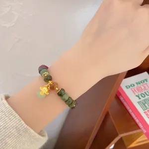 Colorful jade bead bracelet with lucky cat pendant, ethnic retro style detail view for women.