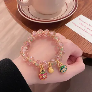 Sweet pink glass rose bead bracelet with cute golden monster pendants and beads for women.