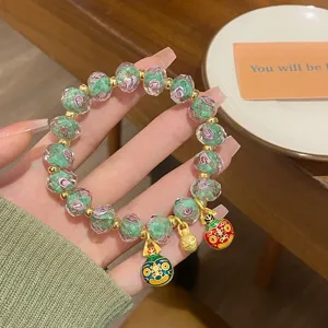 Sweet fresh green floral glass beaded bracelet with cute charms, elegant women jewelry.