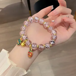Sweet pink glass flower beaded bracelet with gold charms and cute pendants for girls daily wear