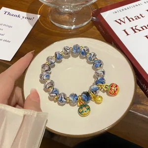 Sweet fresh style colored glaze bead bracelet with cute gold charms and decorative beads.