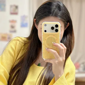 Detail shot of magnetic polka dot phone case with shell texture and transparent edges.