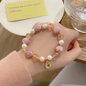 Bracelet de fleurs en verre exquis avec des perles douces et des perles craquelées, style fée.