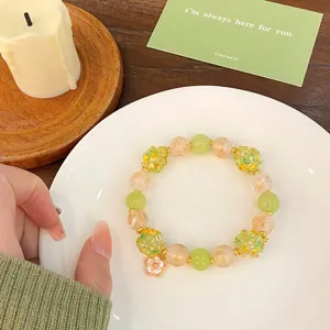 Bracelet de perles en verre vert et orange avec pendentif fleur, bijou de mode style doux.