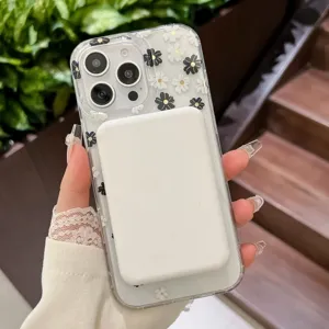 Clear MagSafe phone case detail with black and white daisy floral pattern on mobile.