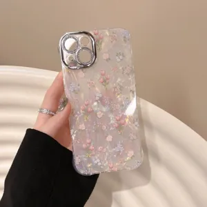 Floral shell texture iPhone case with dazzling diamond camera frame, drop-proof design for daily use.