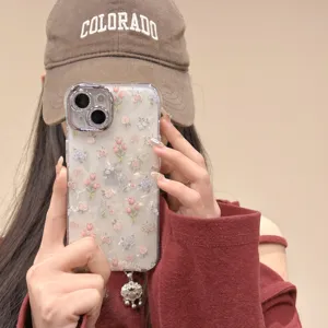 Tulip floral shell phone case detail view, pearlescent texture, camera protection ring.