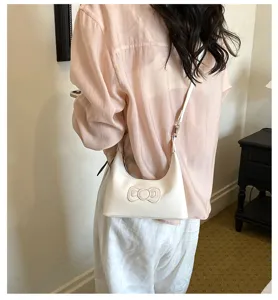Casual white shoulder bag for women, cute bow design, versatile underarm bag for daily use.
