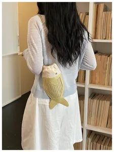 Unique hollow fish crossbody bag with chain strap, retro style mobile phone shoulder bag.