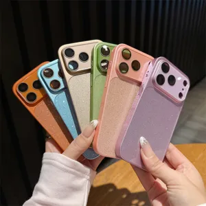 Close-up of colorful glitter phone cases with large window camera protection for iPhone models.