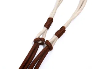 Detailed closeup of durable beige and brown woven strap accessory for outdoor bags and lanyards.