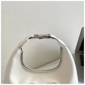Detail shot of a stylish white hobo shoulder bag featuring a metallic buckle and secure zipper.