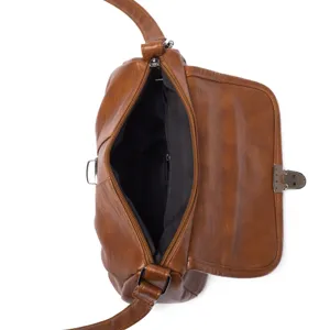 Womens vintage brown shoulder crossbody bag interior detail showing zipper pocket and clasp.