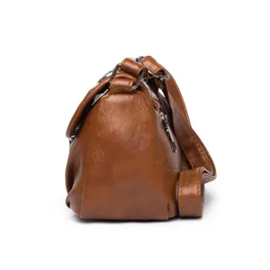 Brown vintage leather crossbody shoulder bag side detail view, stylish women's everyday purse.