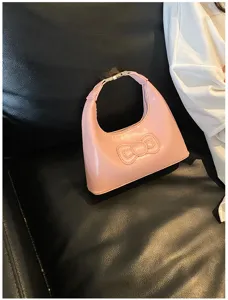 Cute pink bow underarm bag for women, stylish hobo handbag with large capacity and shoulder strap.