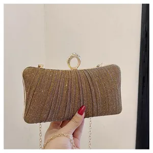Elegant gold sparkling evening clutch bag with rhinestone ring clasp and chic chain strap.