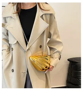 Gold shell acrylic crossbody bag with chain strap, stylish designer evening shoulder bag.