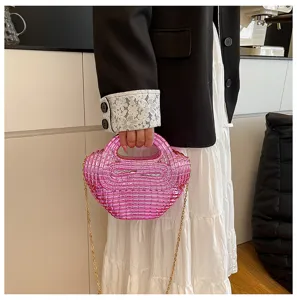 Pink acrylic beaded dumpling handbag with gold chain strap, stylish shoulder cross body bag.
