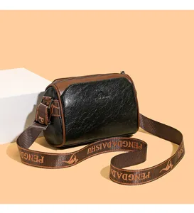 Retro women's pillow shoulder bag, black and brown contrast crossbody bag with wide strap.