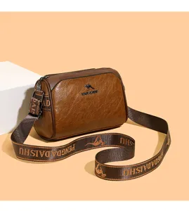 Retro brown pillow shoulder bag for women, luxury designer crossbody bag with branded strap.