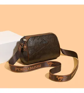 Brown retro women pillow shoulder bag with branded strap, stylish cross-body daily use purse.