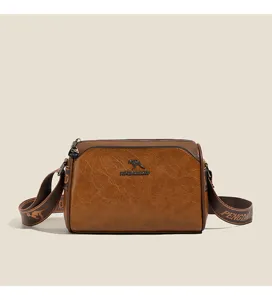 Retro brown crossbody pillow bag with chic strap and vintage texture for daily casual wear.